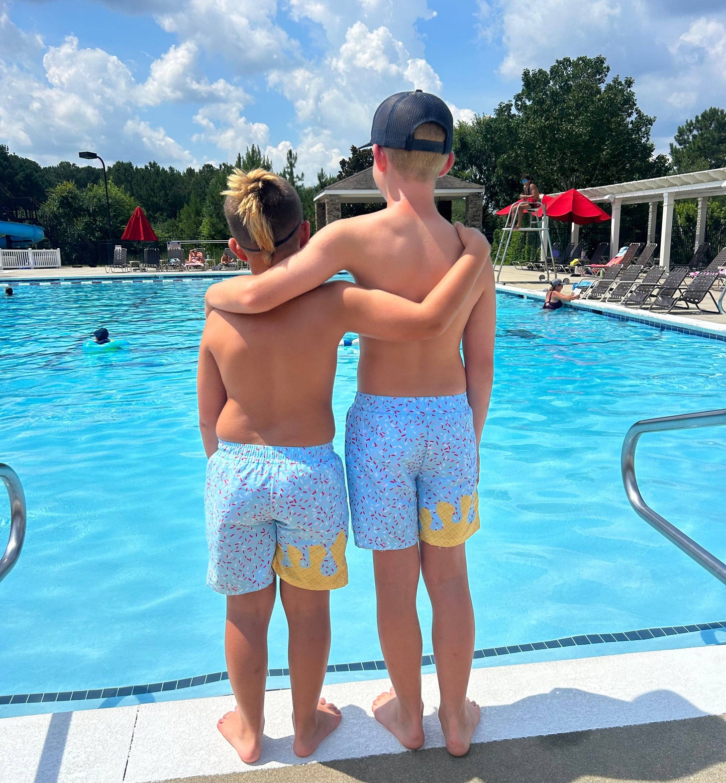 Ice Cream Drip swim trunks pink