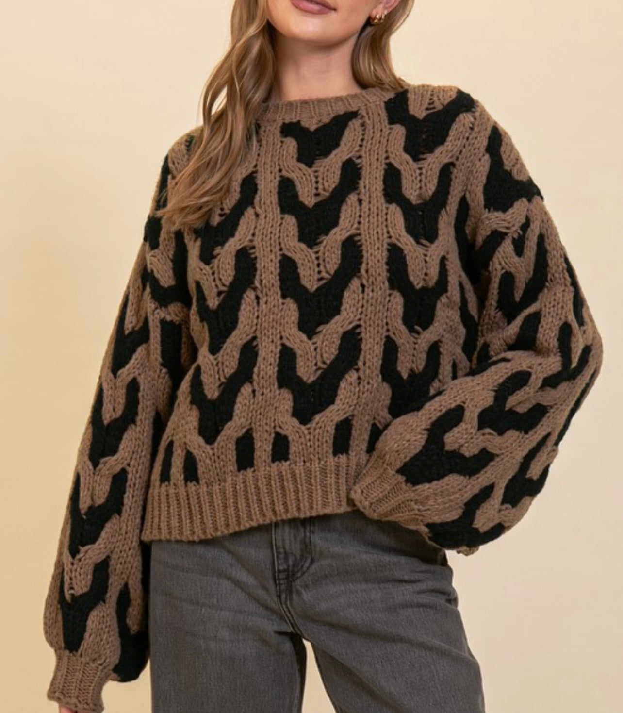 Bold black and brown cable knit sweater